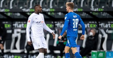 Marcus Thuram (L) and Stefan Posch clash at the match in Monchengladbach, Germany, Dec. 19, 2020. (Reuters Photo)