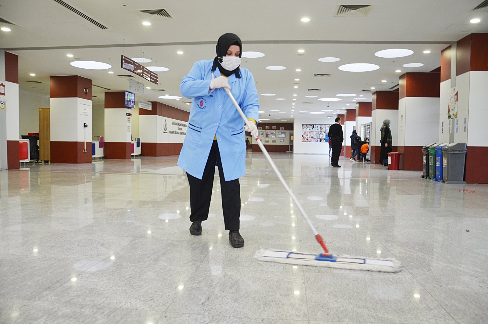 Nurten Gündoğdu cleans the floor at a hospital in Istanbul, Turkey, Dec. 20, 2020. (AA PHOTO)