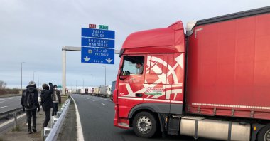 Migrants face off with a truck driver on the A16 highway near Calais, northern France, Dec. 18, 2020. (Reuters Photo)