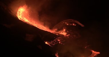 In this photo provided by the U.S. Geological Survey, lava flows within the Halema’uma’u crater of the Kilauea volcano, Dec. 20, 2020. (U.S. Geological Survey via AP)