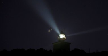 View of the conjunction of Saturn and Jupiter in the sky over Santa Pola, Alicante, eastern Spain 21 December 2020. (EPA Photo)