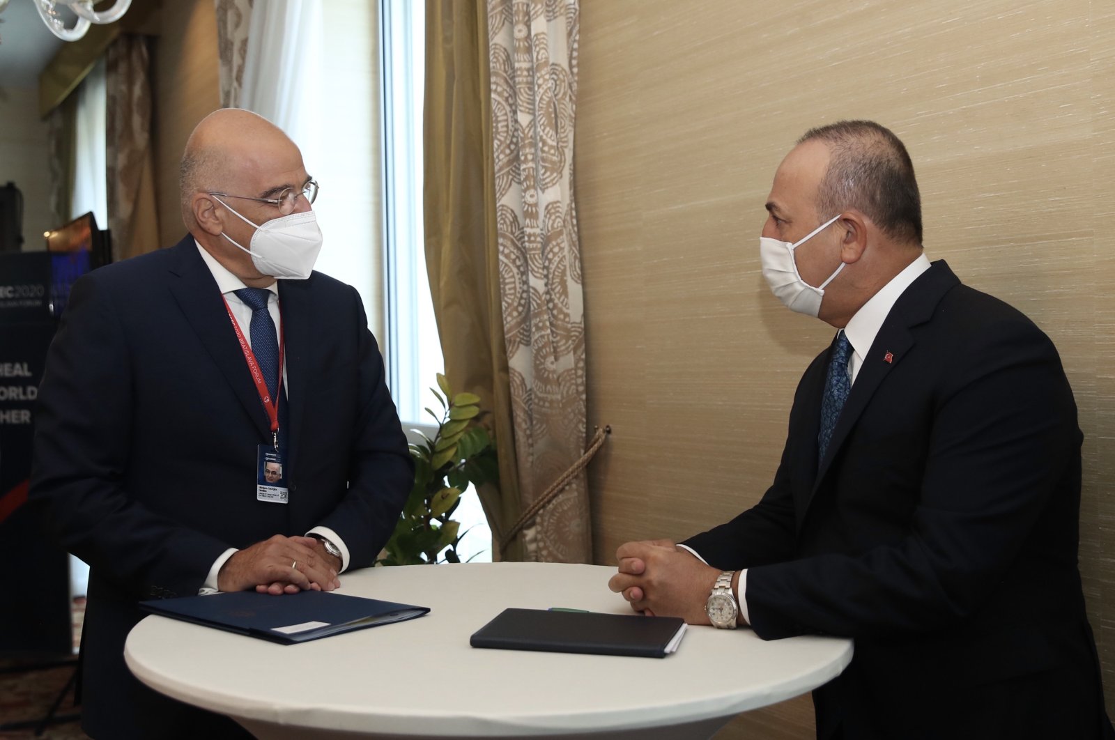 Foreign Minister Mevlüt Çavuşoğlu (R) speaks with Greek counterpart Nikos Dendias on the sidelines of the Bratislava Forum, in Bratislava, Slovakia, Oct. 12, 2020. (AA Photo)