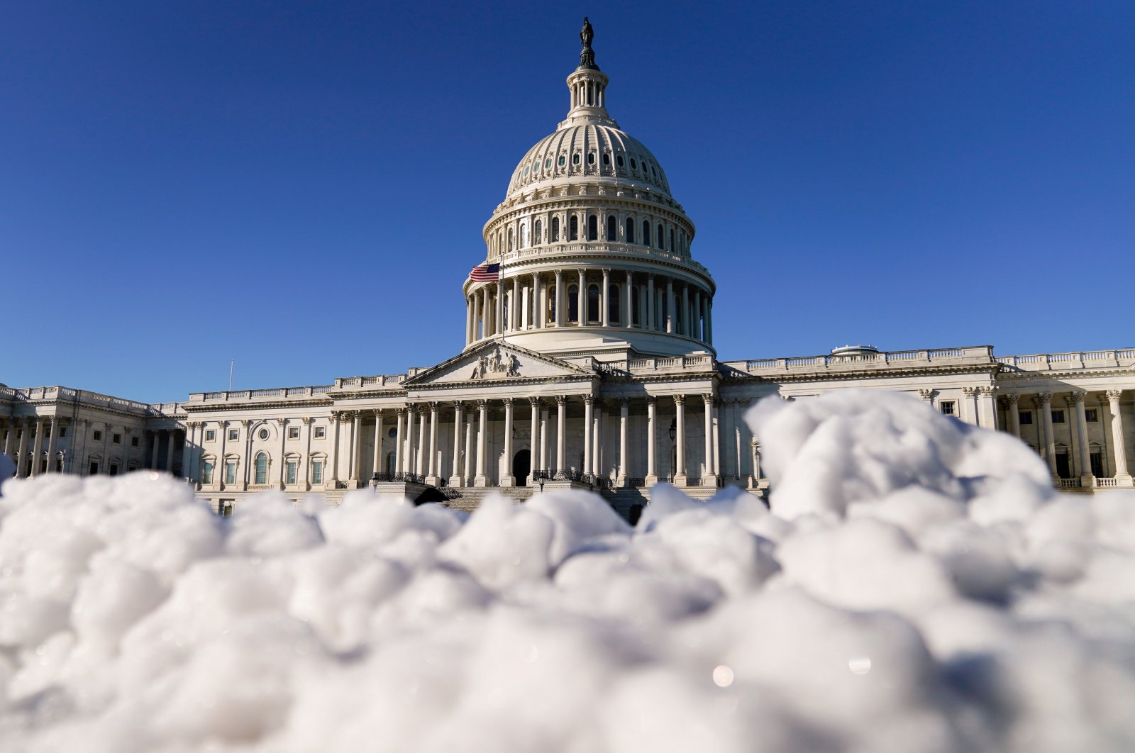 The U.S. Capitol is seen behind melting snow in Washington, D.C., U.S., Dec. 17, 2020. (Reuters Photo)