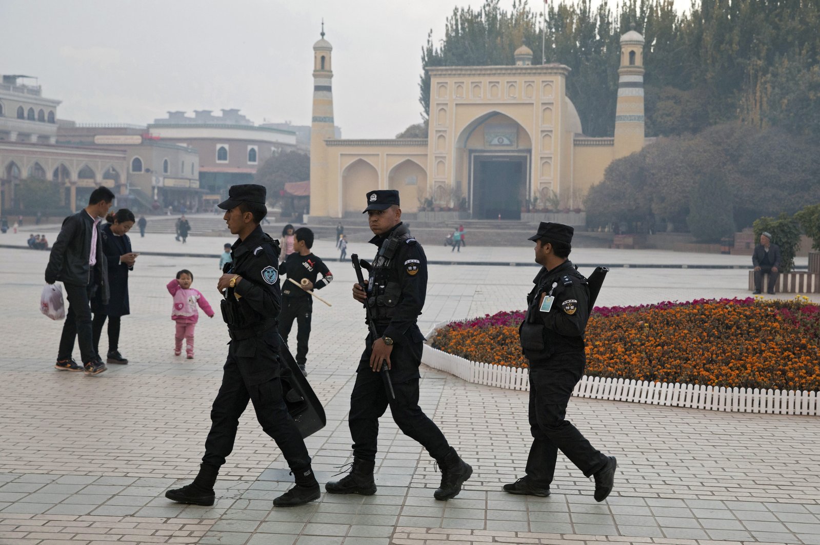 Uighur security personnel patrol near the Id Kah Mosque in Kashgar in western China's Xinjiang region, Nov. 4, 2017. (AP Photo)