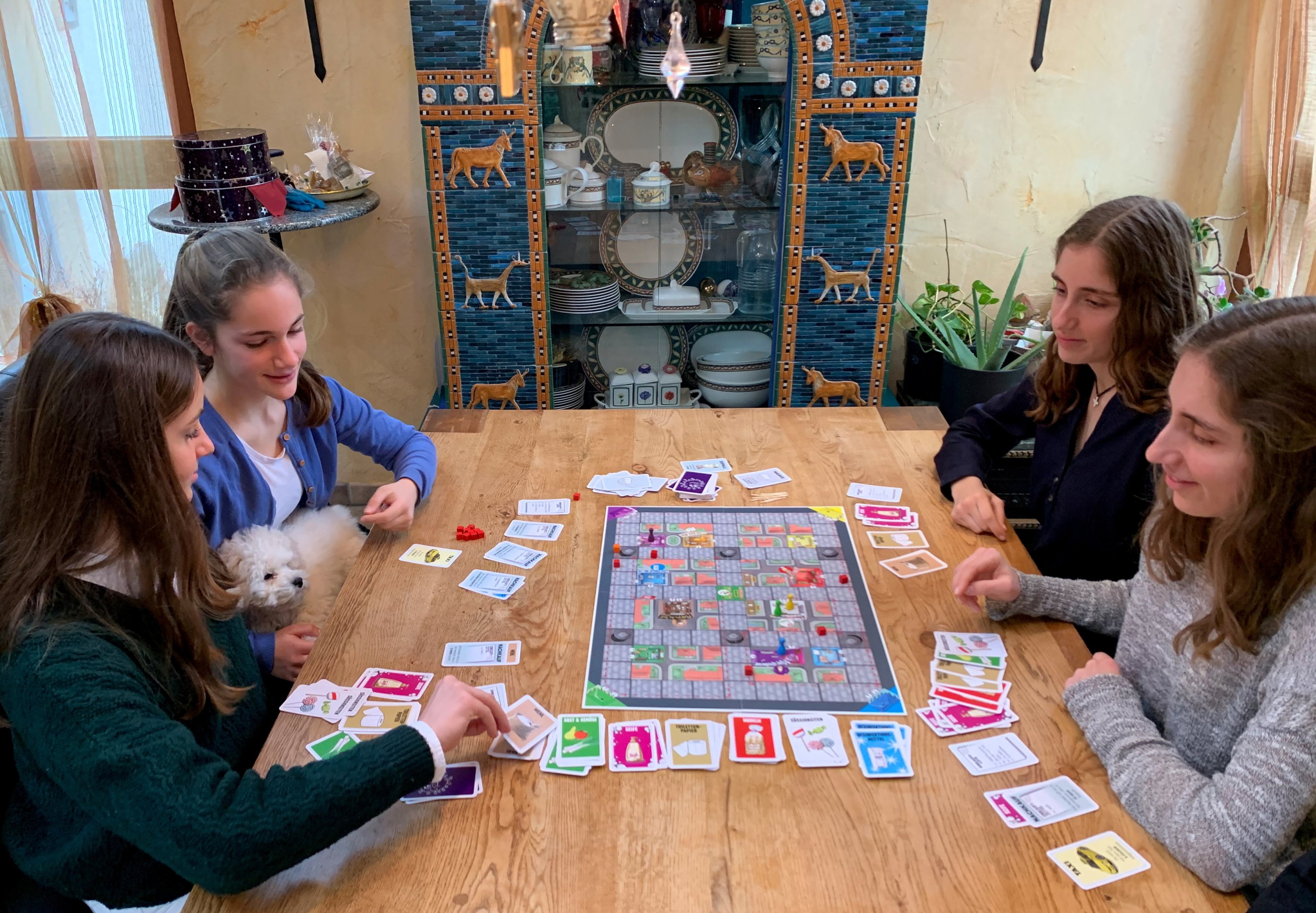 German sisters invent a coronavirus board game to play during the Christmas shutdown, in Wiesbaden Biebrich, Germany, Dec. 20, 2020. (REUTERS/Annkathrin Weiss)