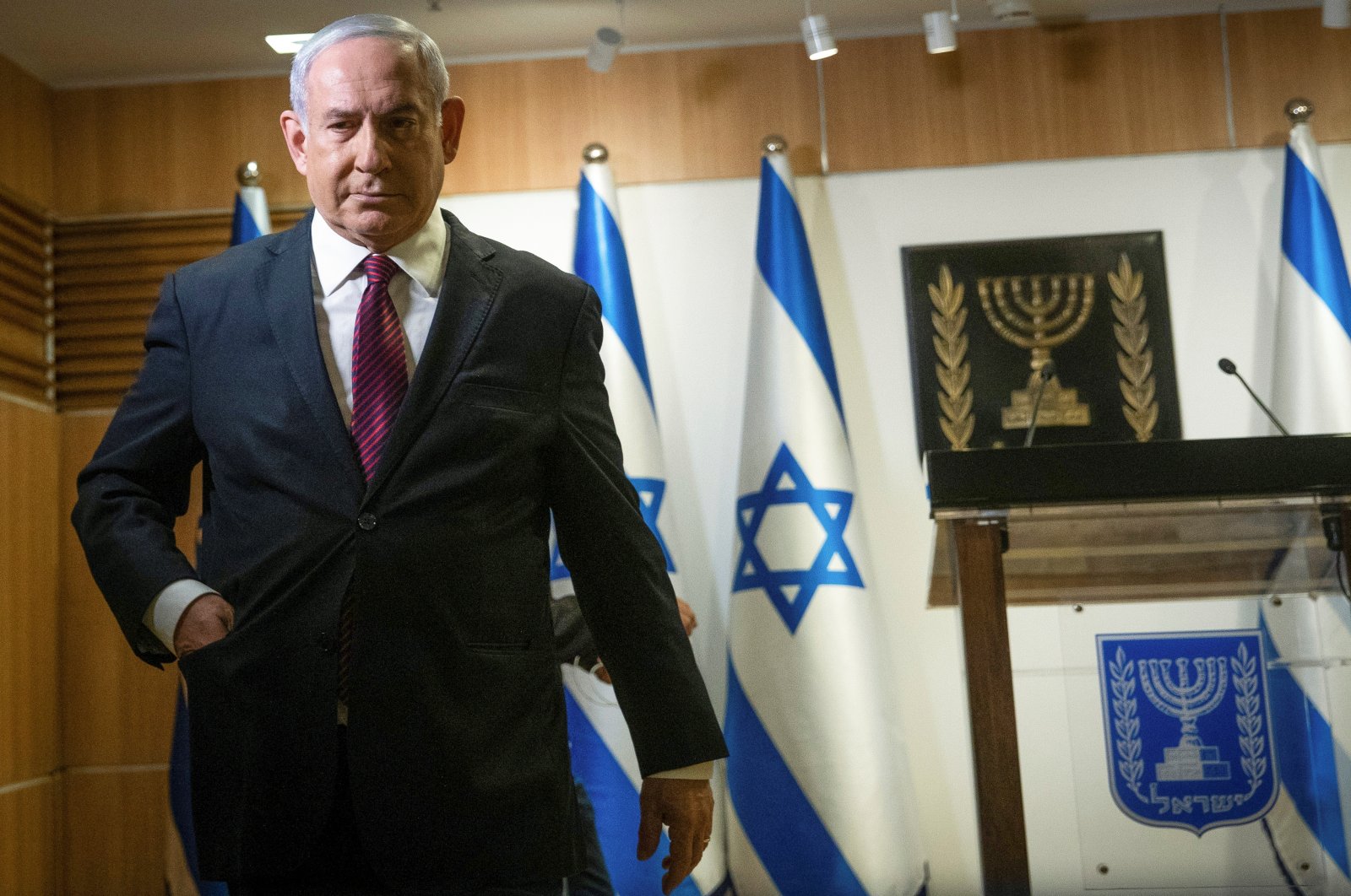 Israeli Prime Minister Benjamin Netanyahu walks after he delivered a statement at the Knesset (Israel's parliament) in Jerusalem, December 22, 2020. (Yonatan Sindel/Pool via Reuters)