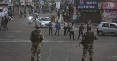 Indian paramilitary soldiers stand guard during curfew-like restrictions in Jammu, India, Aug. 5, 2019. (AP Photo)