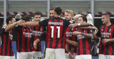 AC Milan's Zlatan Ibrahimovic embraces his teammates at the end of a Serie A match against Inter Milan at the San Siro Stadium, in Milan, Italy, Oct. 17, 2020. (AP Photo)