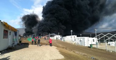 Smoke rises from a fire at the Lipa migrant camp, near Bihac in western Bosnia-Herzegovina, Dec. 23, 2020. (AP Photo)