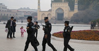 Uighur security personnel patrol near the Id Kah Mosque in Kashgar in western China's Xinjiang region, Nov. 4, 2017 (AP Photo)