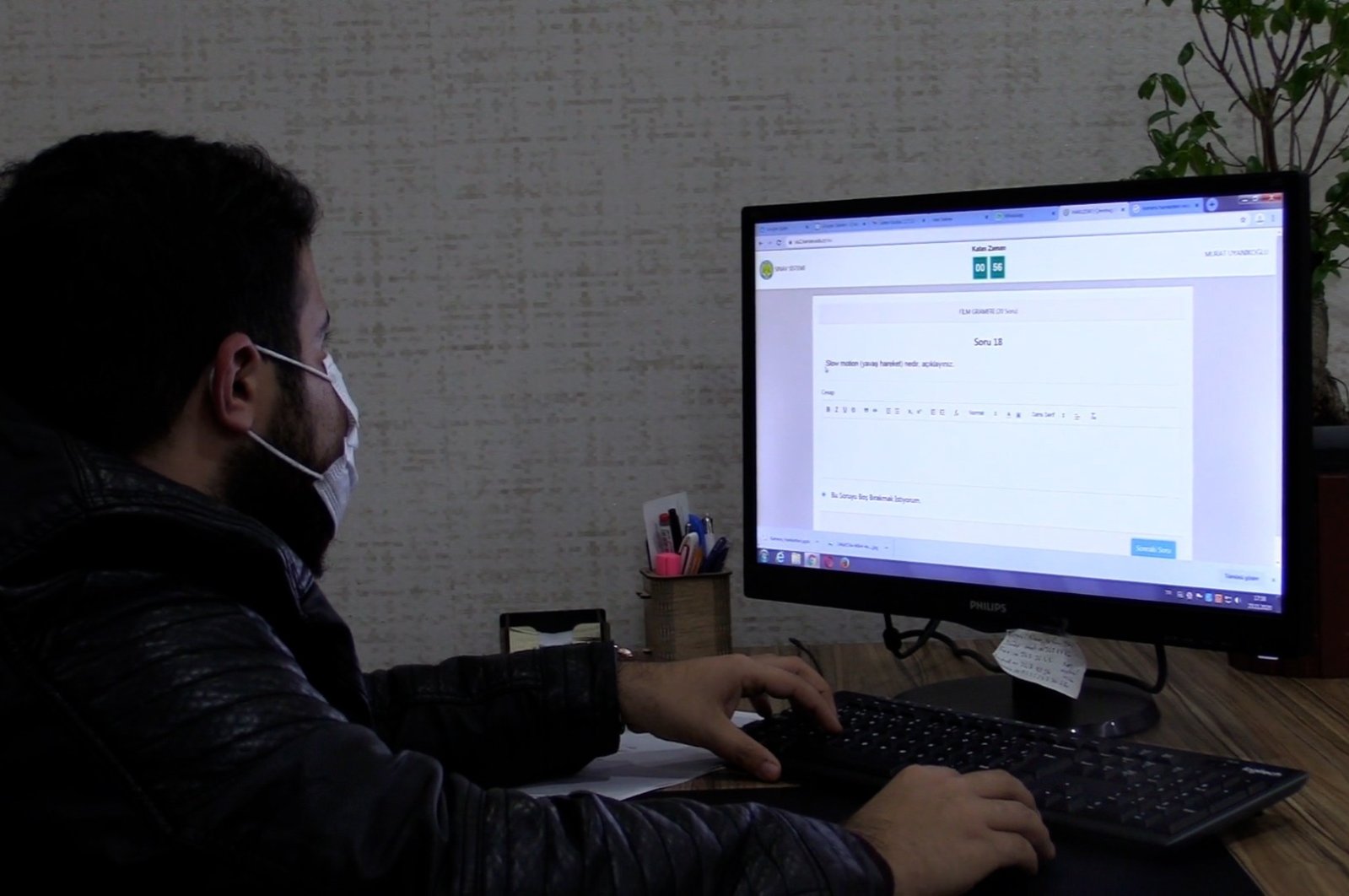 A student takes an online exam on a computer in the Karaköprü Municipality in Şanlıurfa province, southeastern Turkey, Nov. 24, 2020. (IHA Photo)