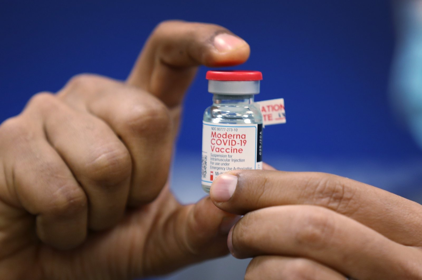 Dave Lacknauth, Director of Pharmacy Services at Broward Health Medical Center holds a bottle of the Moderna COVID-19 vaccine during a press conference on Dec. 23, 2020 in Fort Lauderdale, Florida. (AFP Photo)