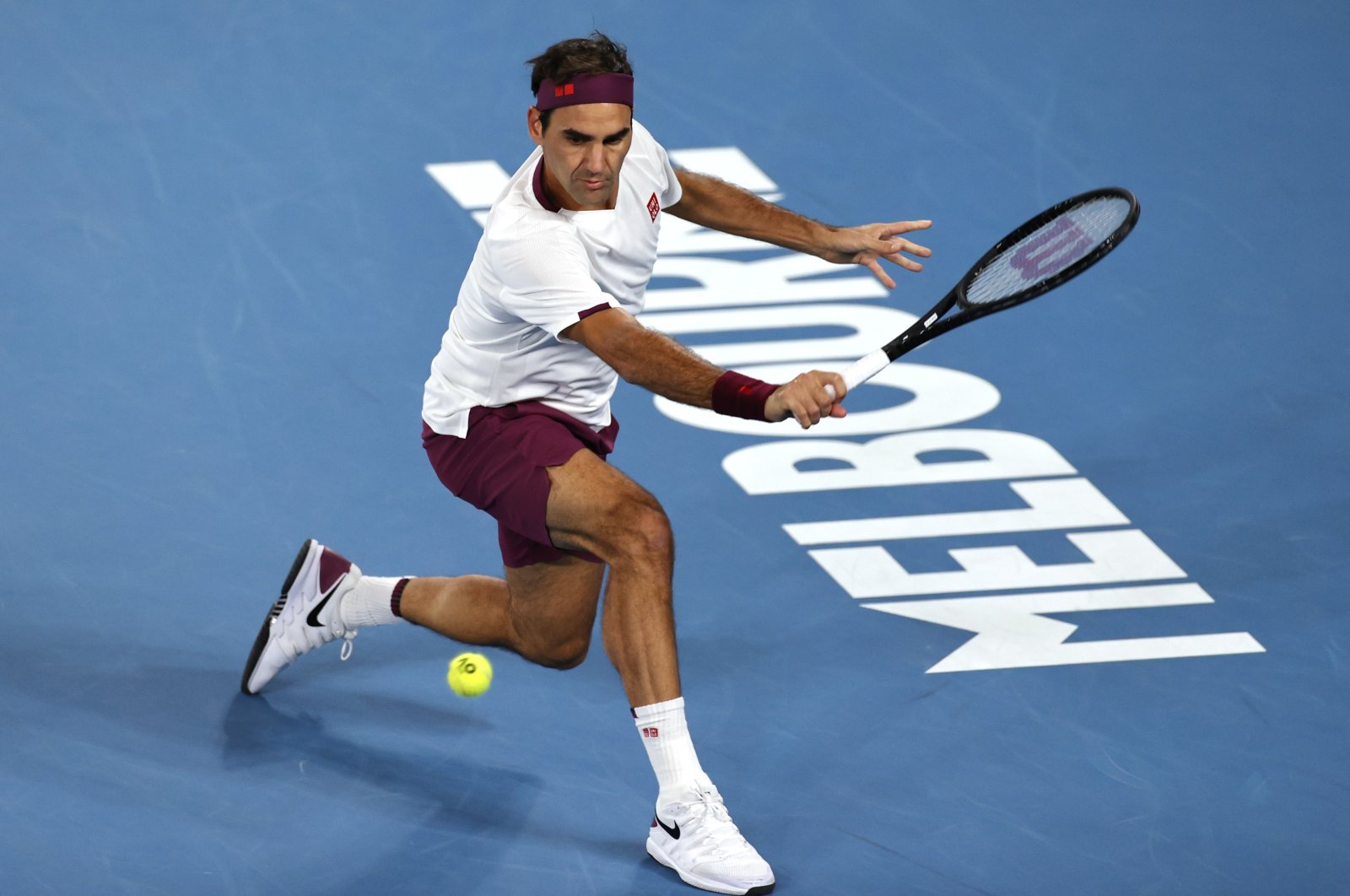 Roger Federer makes a return to Marton Fucsovics during their fourth round match at the Australian Open tennis championship in Melbourne, Australia, Jan. 26, 2020. (AP Photo)