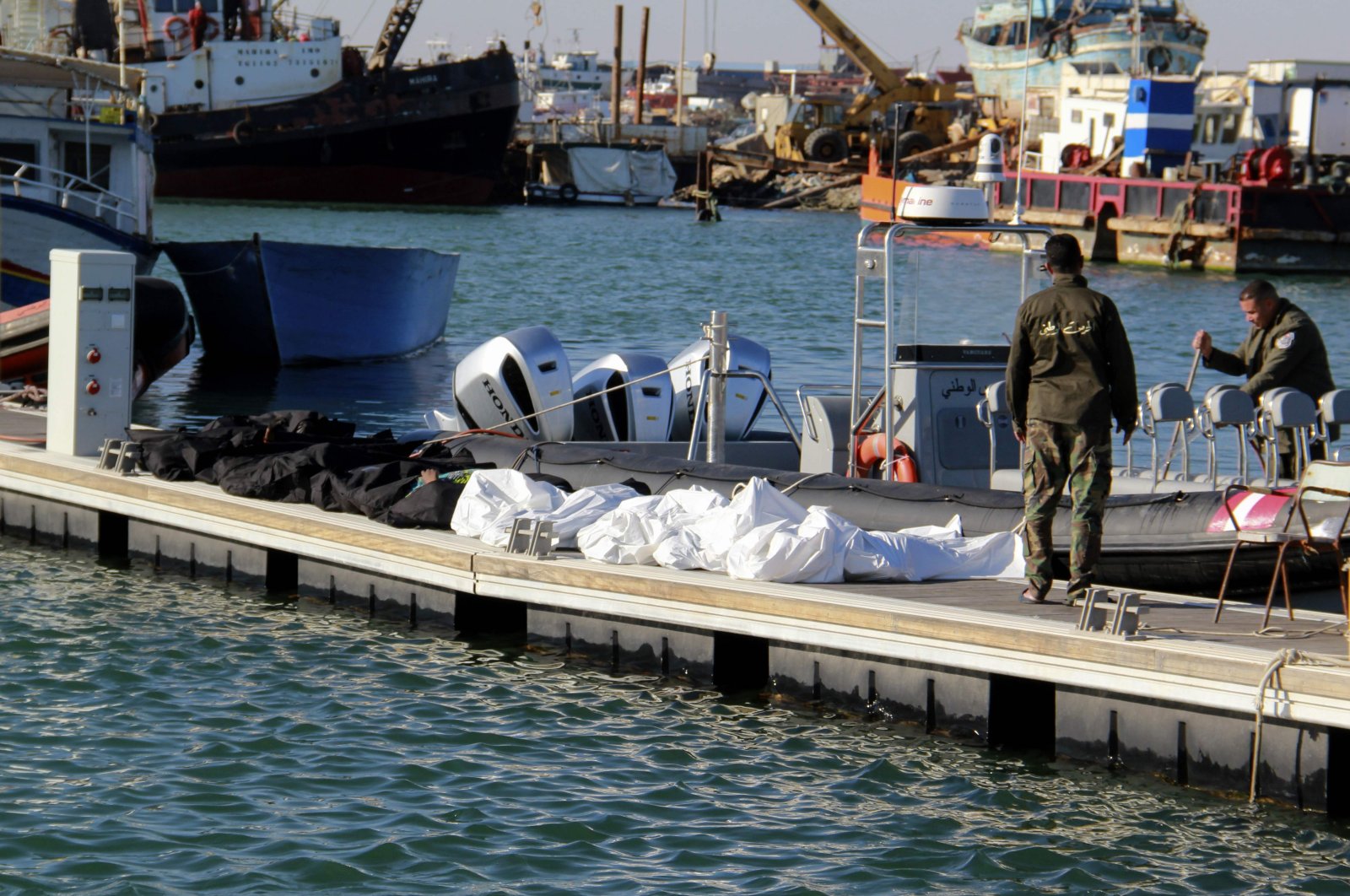 Tunisia's coastguards retrieve the bodies of 20 migrants from sub-Saharan Africa after their boat capsized, at the port of Sfax in central Tunisia on Dec. 24, 2020. (AFP Photo)