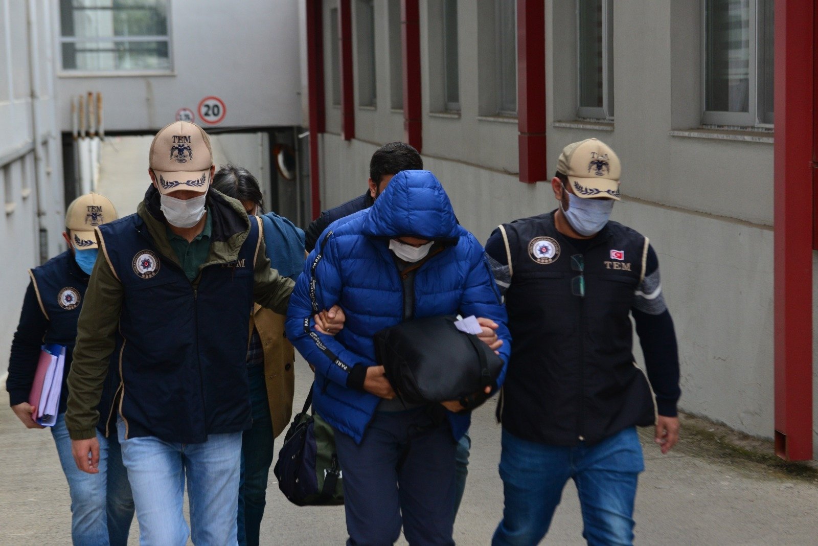 Police escort FETÖ suspects captured in an operation in Adana, southern Turkey, Dec. 14, 2020. (AA PHOTO)