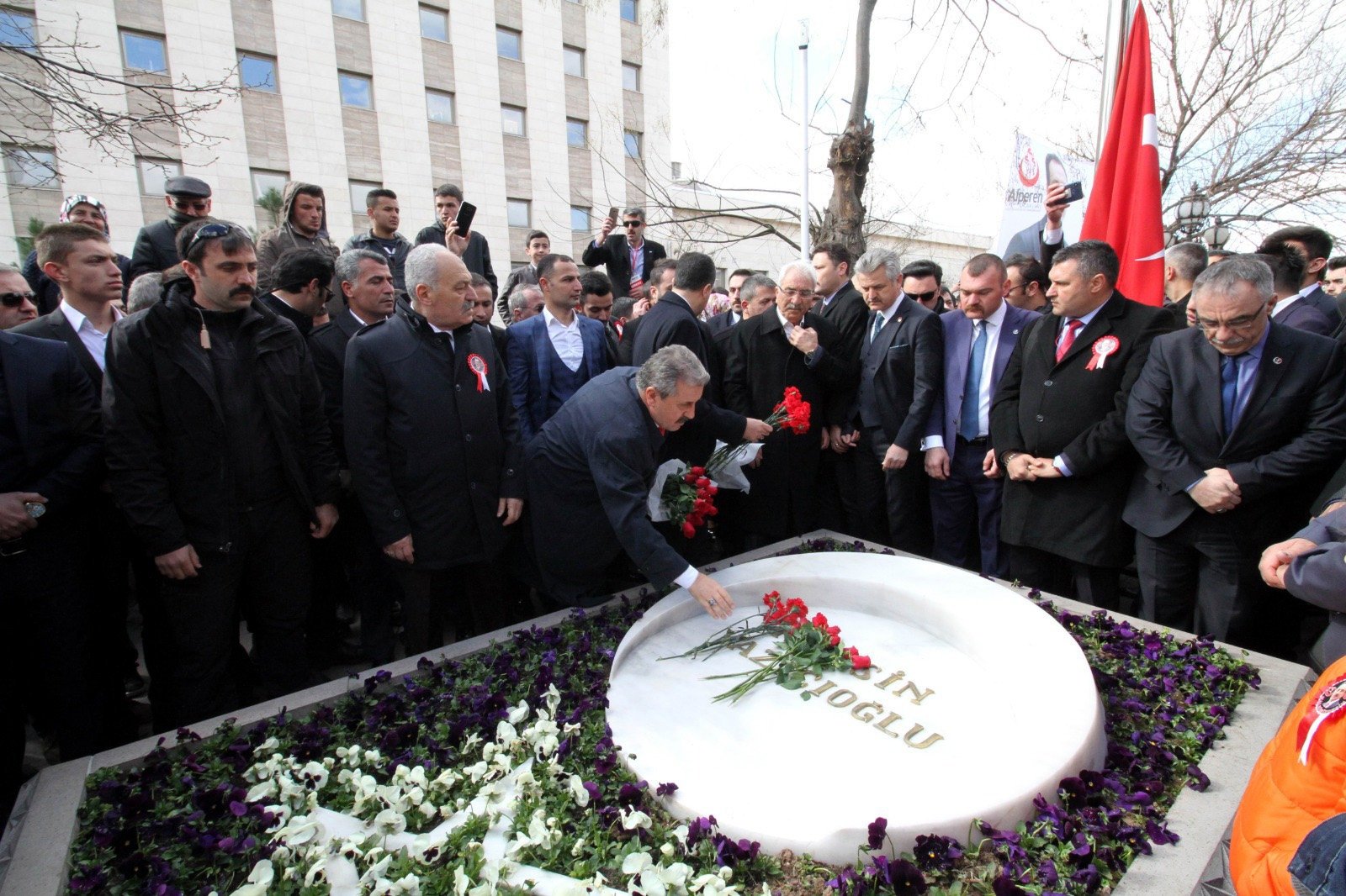 People lay flowers on the grave of Muhsin Yazıcıoğlu, in the capital Ankara, Turkey, March 26, 2019. (DHA PHOTO)