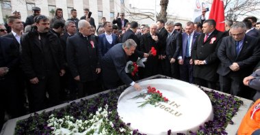 People lay flowers on the grave of Muhsin Yazıcıoğlu, in the capital Ankara, Turkey, March 26, 2019. (DHA PHOTO)