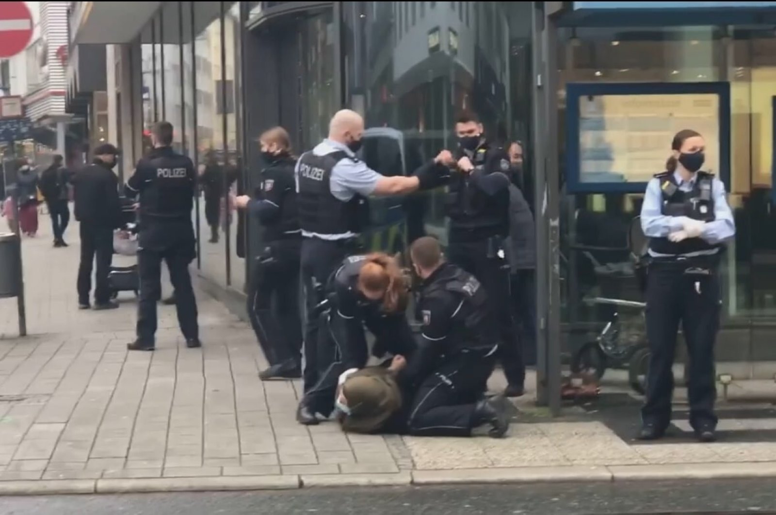 German police violently arrest Muslim woman with toddler for not wearing  mask | Daily Sabah