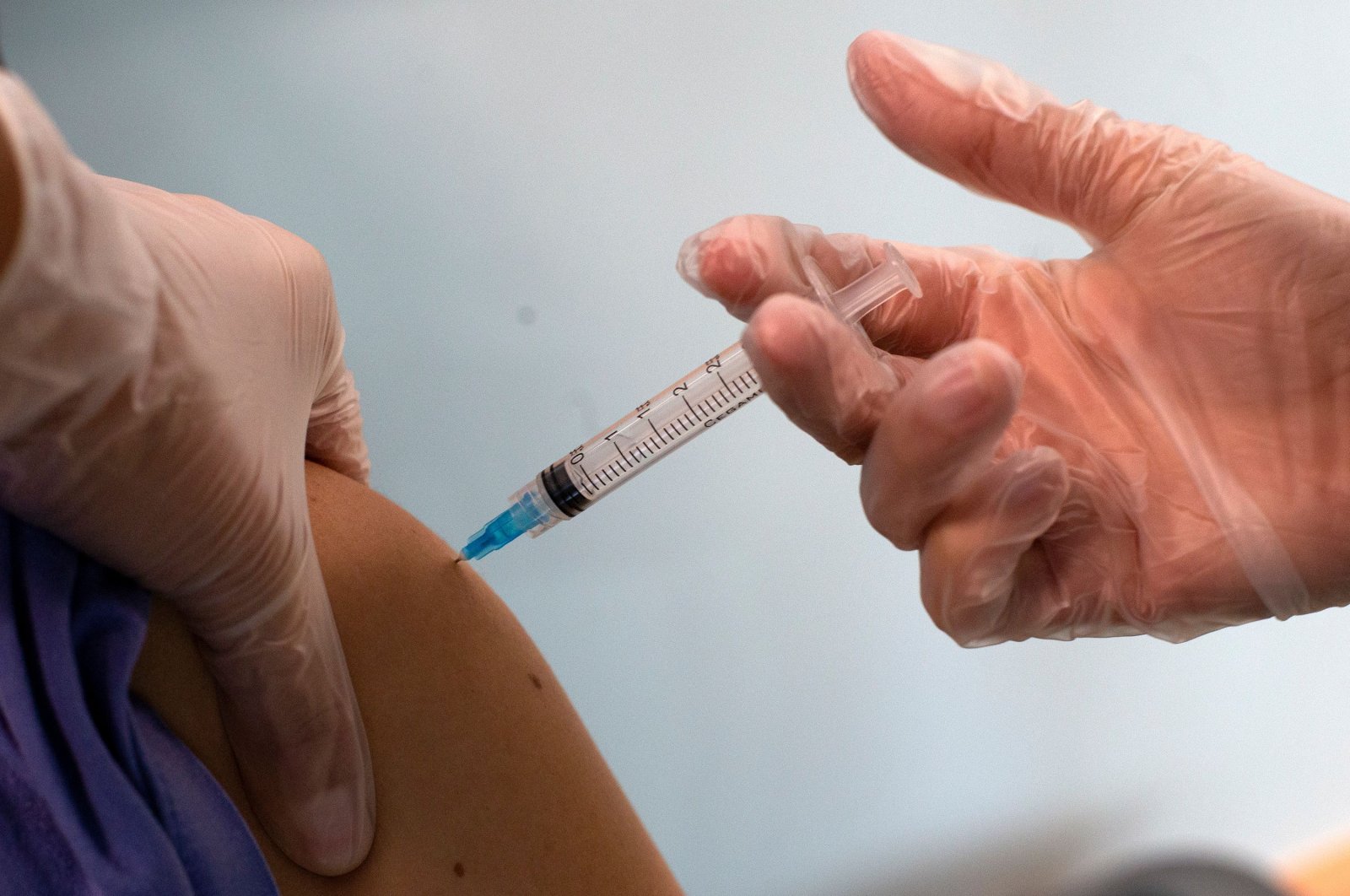 A medical worker receives the Pfizer/BioNTech COVID-19 vaccine jab at Hospital Posta Central in Santiago, Dec. 24, 2020. (AFP File Photo)