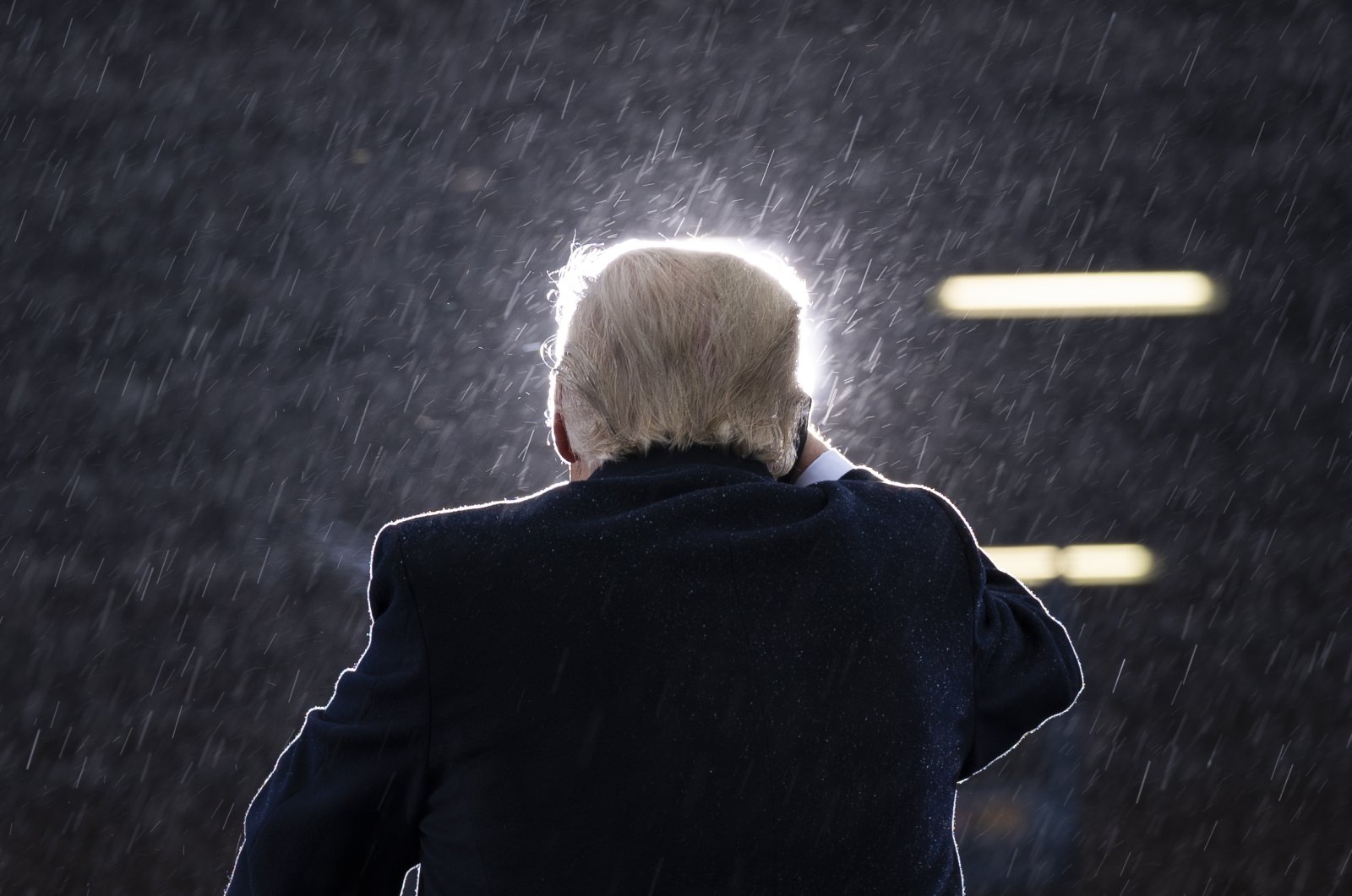 President Donald Trump speaks in the rain during a campaign rally at Capital Region International Airport in Lansing, Michigan, on Oct. 27, 2020. (AP Photo)