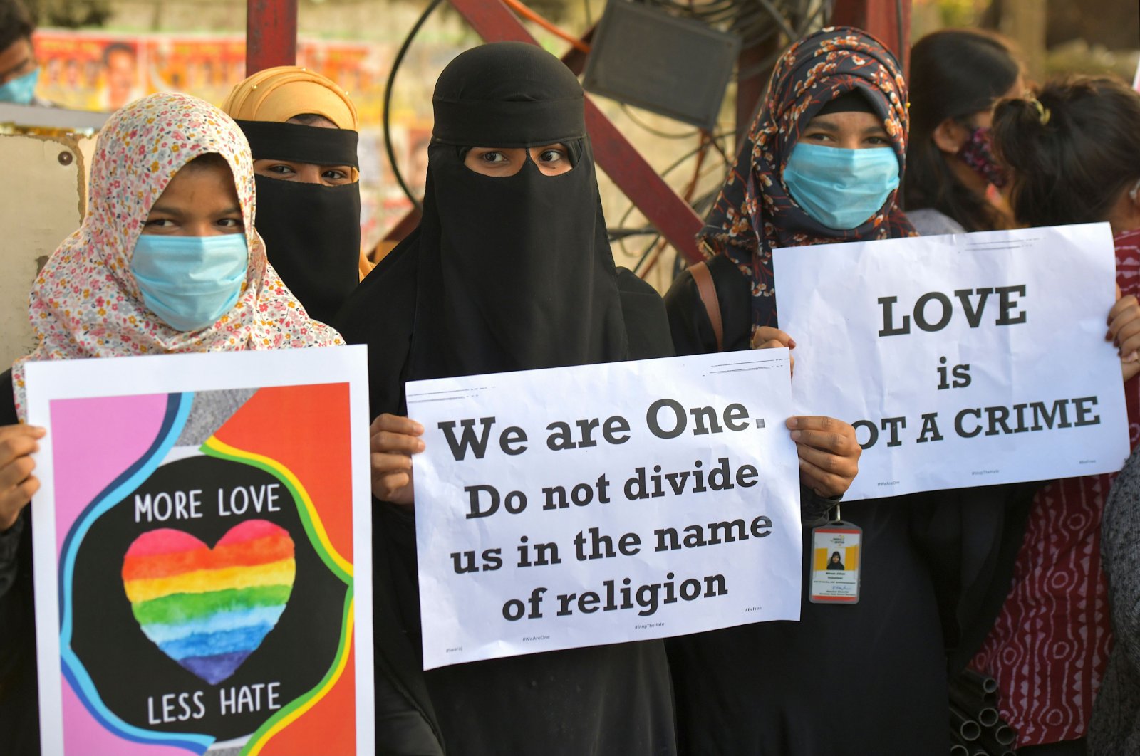 Activists belonging to various human and civil rights organizations hold placards during a demonstration condemning laws against Love Jihad in Bangalore. (AFP Photo)