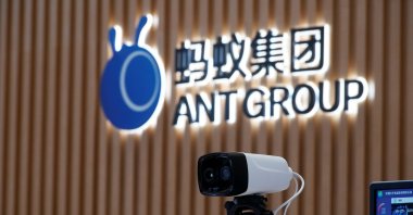 A thermal imaging camera stands in front of the Ant Group logo at its headquarters in Hangzhou, Zhejiang province, China, on Oct. 29, 2020. (Reuters Photo)