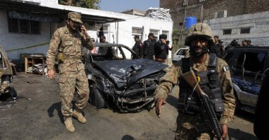 Pakistani soldiers inspect the site of a suicide bombing in Shabqadar, Pakistan, March 7, 2016. (AFP Photo)