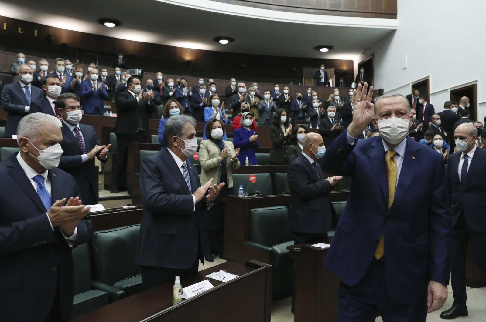 President Recep Tayyip Erdoğan gestures as he arrives to speak to his ruling party's lawmakers, in Ankara, Turkey, Dec. 23, 2020. (AP Photo)