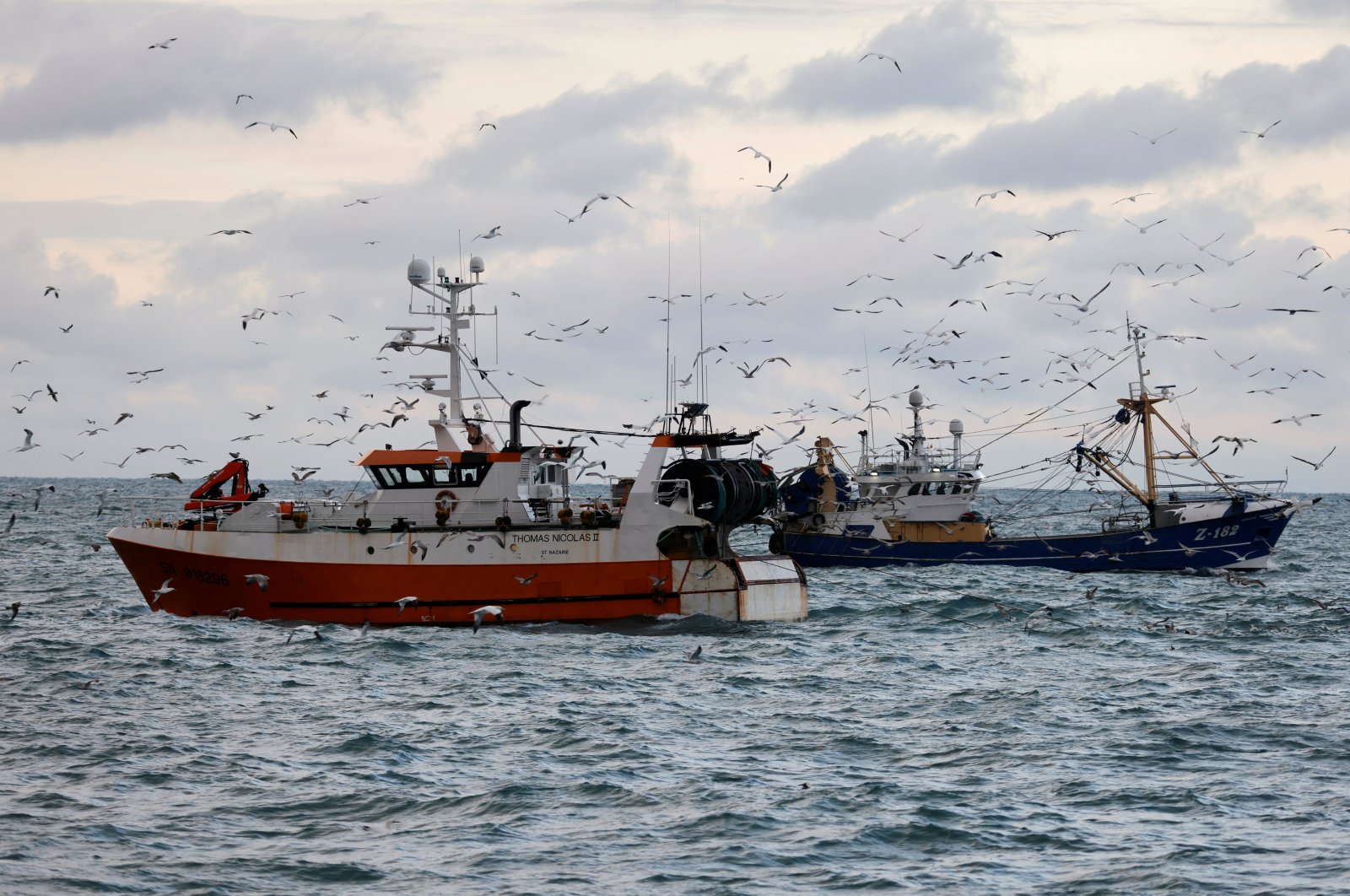 In this file photo, the French trawler "Thomas Nicolas II" sails past a Dutch trawler in the North Sea, off the coast of northern France, Dec. 7, 2020. (Reuters Photo)