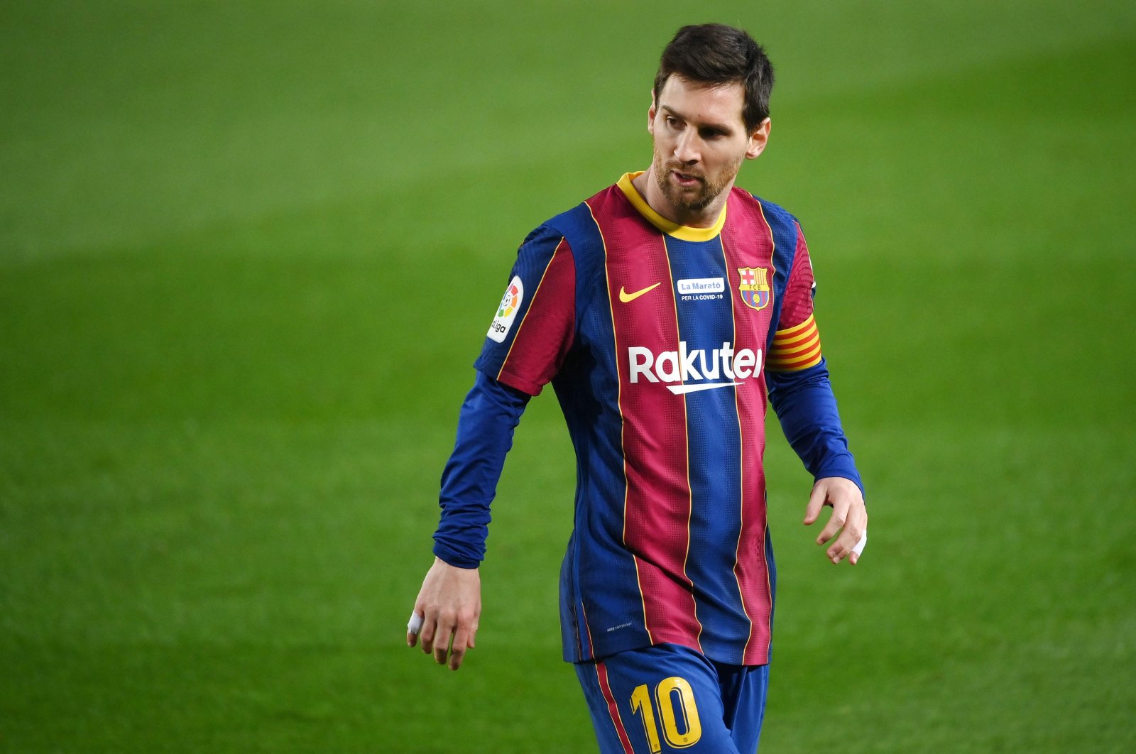 Barcelona's Lionel Messi walks on the pitch during a La Liga match against Valencia at the Camp Nou stadium in Barcelona, Spain, Dec. 19, 2020. (AFP Photo)