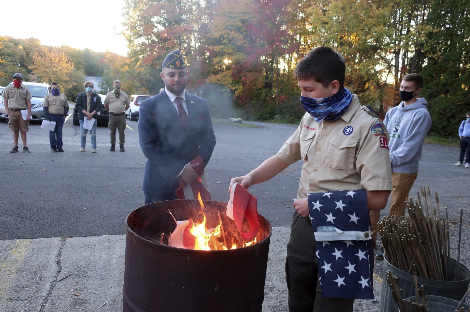 In this Oct.13, 2020 file photo, Jondavid Longo (C), the Republican mayor of Slippery Rock, Pa., presides over a Boy Scouts flag retirement ceremony where worn-out flags are cut up and burned in Slippery Rock. (AP Photo)