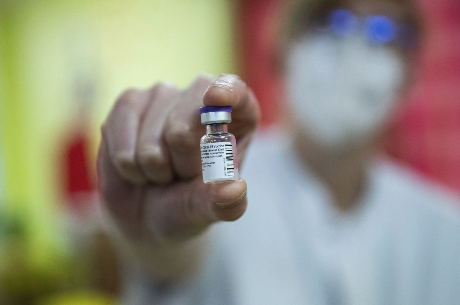 A nurse holds a vial of the COVID-19 vaccine at La Bonne Maison de Bouzanton care home in Mons, Belgium, Dec. 28, 2020. (AP Photo)