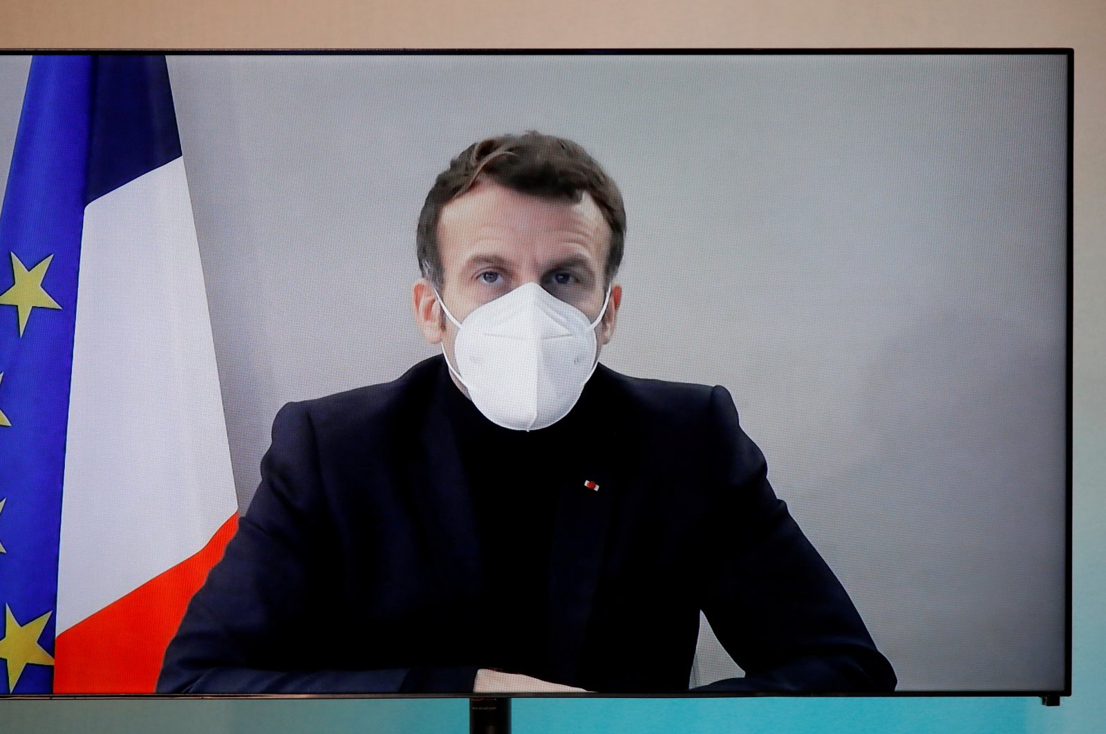 French President Emmanuel Macron on a screen as he attends a conference round table via videoconference in Paris, France, Dec. 17, 2020. (Reuters Photo)