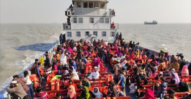 Rohingya refugees travel in a naval ship to be transported to an isolated island in the Bay of Bengal, in Chittagong, Bangladesh, Tuesday, Dec. 29, 2020. (AP Photo)