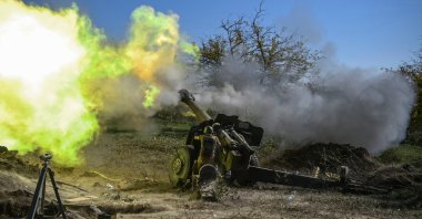 An Armenian soldier fires artillery on the front line during the ongoing fighting between Armenian and Azerbaijani forces over the region of Nagorno-Karabakh, Oct. 25, 2020. (AFP)