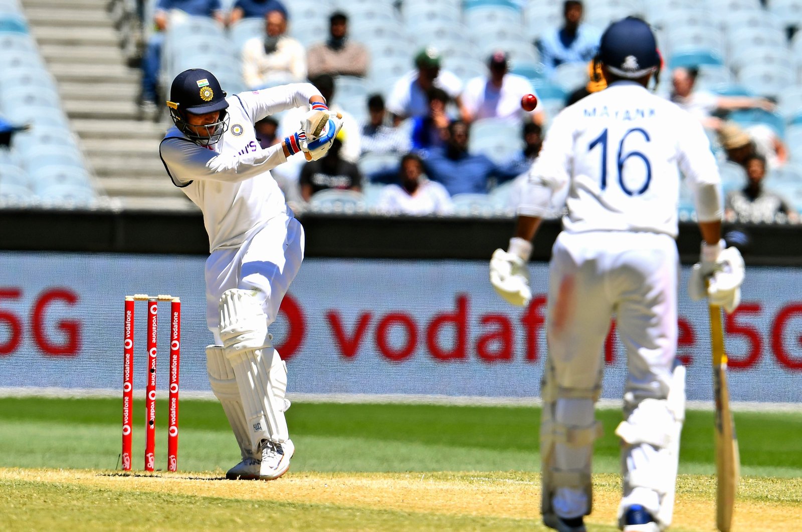 India's batsman Shubman Gill (L) plays a shot as teammate Mayank Agarwal looks on, in Melbourne, Australia, Dec. 29, 2020. (AFP PHOTO)