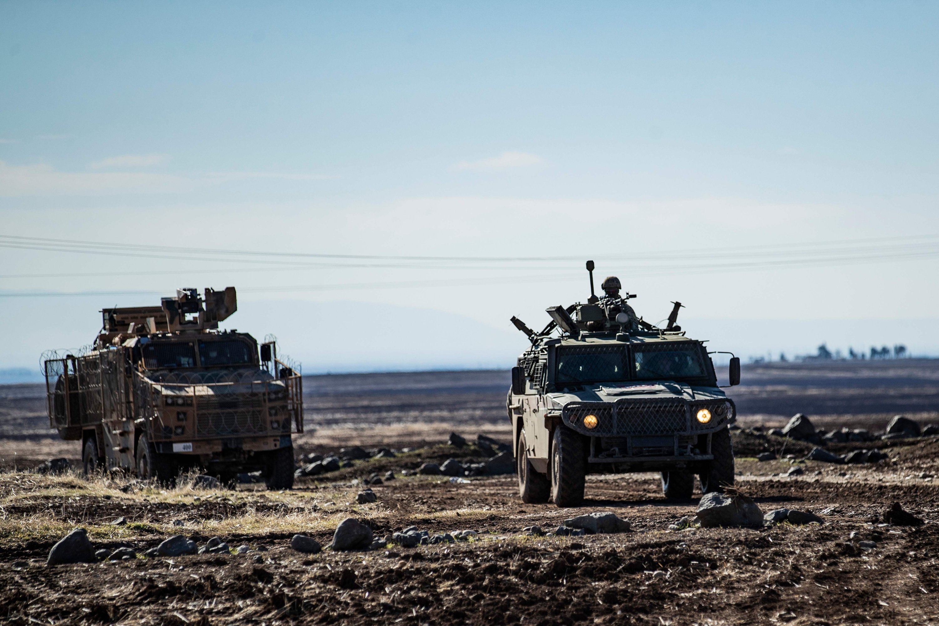 A joint Russian-Turkish patrol advances in the countryside of the Syrian town of al-Jawadiyah, in northeastern Hassakeh province, near the border with Turkey, Dec. 24, 2020. (AFP Photo)