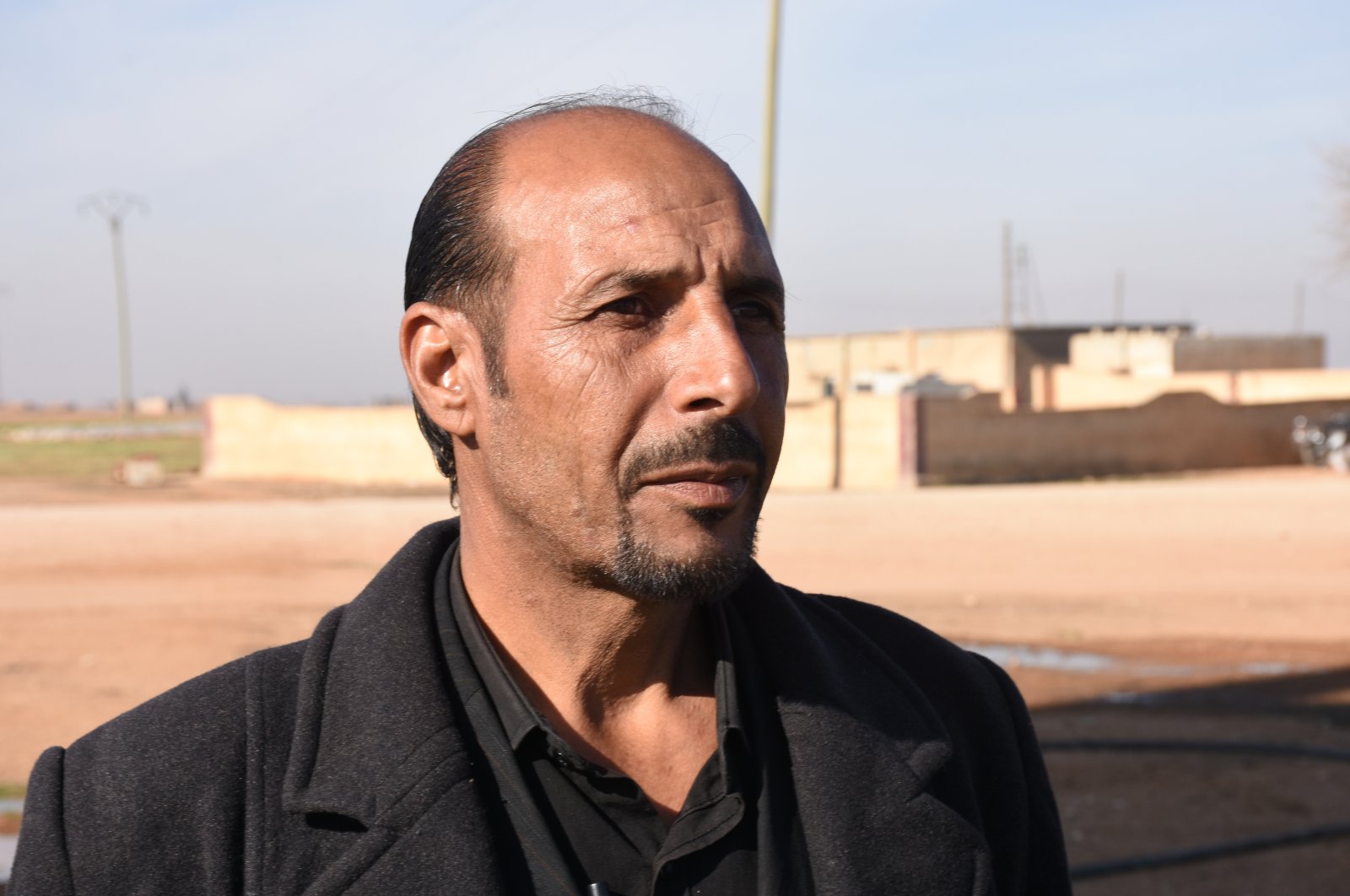 Samer Issa, the water affairs officer of Tel Abyad's local council, talks to Anadolu Agency (AA) in an interview, Tel Abyad, northern Syria, Dec. 29, 2020. (AA Photo)