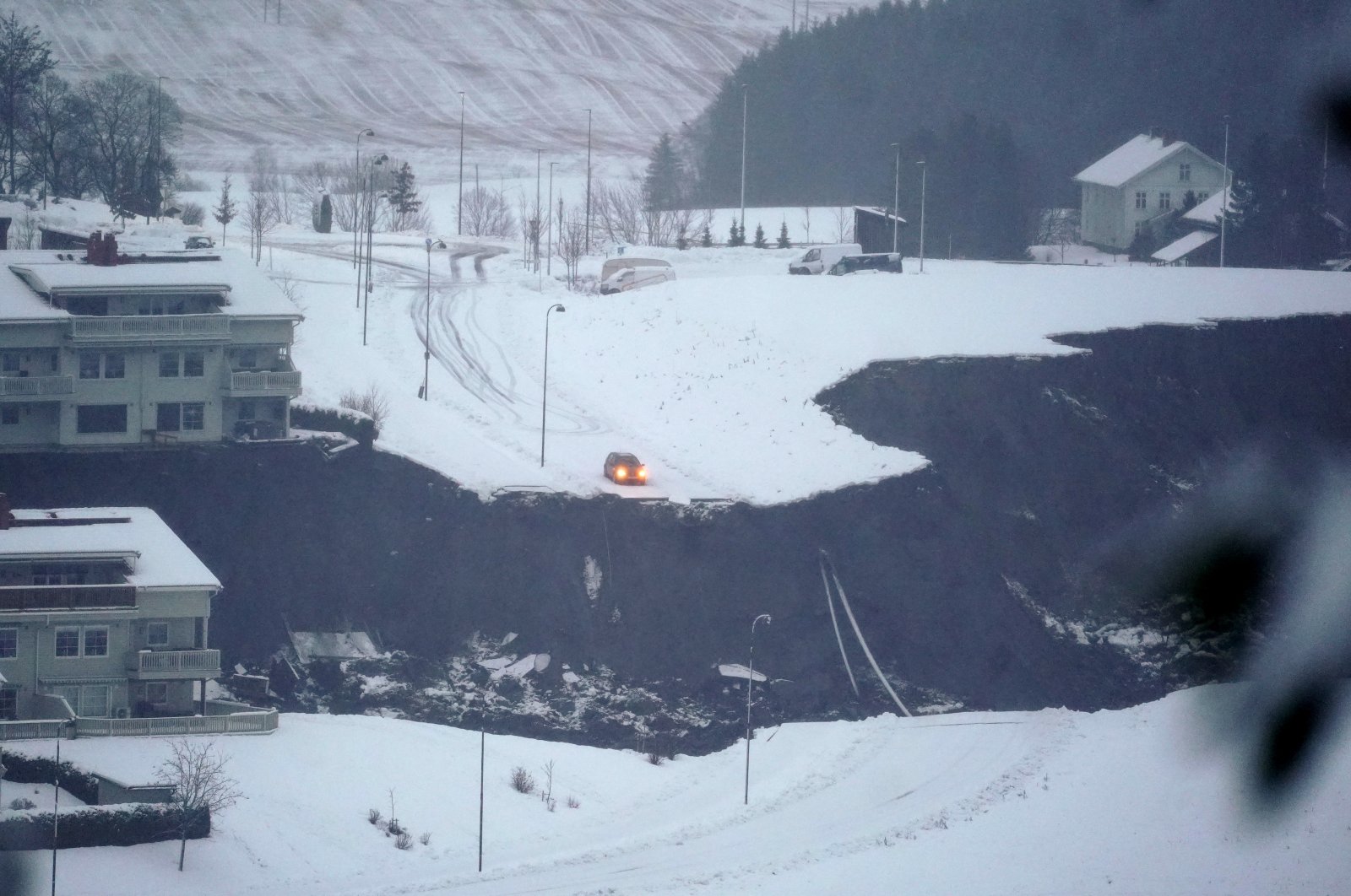 A car stops on the edge of a landslide in the village Ask, some 40 kilometers (25 miles) north of Oslo, Norway, Dec. 30, 2020. (EPA-EFE Photo)