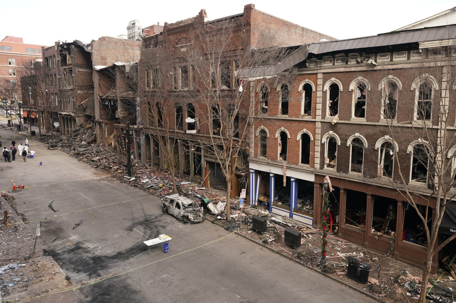 Debris remains on the sidewalks in front of buildings damaged in a Christmas Day explosion in Nashville, Tennessee, U.S., Dec. 29, 2020. (AP Photo)