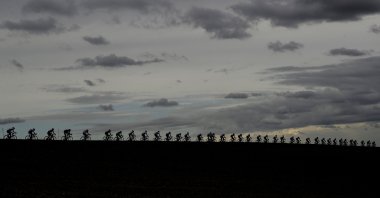 Riders pedal under a cloudy sky during the men's elite event at the road cycling World Championships, in Imola, Italy, Sept. 27, 2020. (AP Photo)