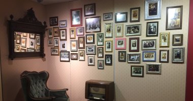 This recreated home parlor features family photographs of Turkey's Jews through the decades, at the Jewish museum in Istanbul, Turkey. (Photo by Paris Achen)