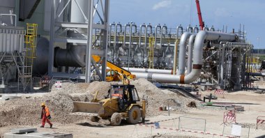A local employee walks at a compressor station of the Trans Adriatic Pipeline (TAP) in Seman near Fier, Albania, April 11, 2019. (Reuters Photo)