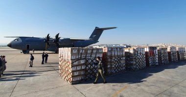 Turkish soldiers prepare to load a military cargo plane with Personal Protection Equipment donated by Turkey to help United States combat the new coronavirus outbreak, at the Etimesgut airport outside Ankara, Turkey, April 28, 2020. (AP Photo)