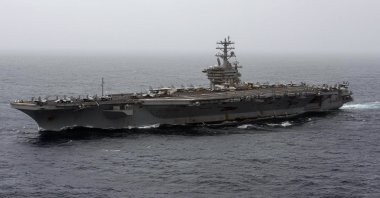 In this Sept. 7, 2020, file photo released by the U.S. Navy, the aircraft carrier USS Nimitz transits the Arabian Sea. The Pentagon announced Thursday, Dec. 31, 2020, that the USS Nimitz, the only Navy aircraft carrier operating in the Middle East, will return home to the U.S. West Coast. (Mass Communication Specialist 3rd Class Elliot Schaudt / U.S. Navy via AP)