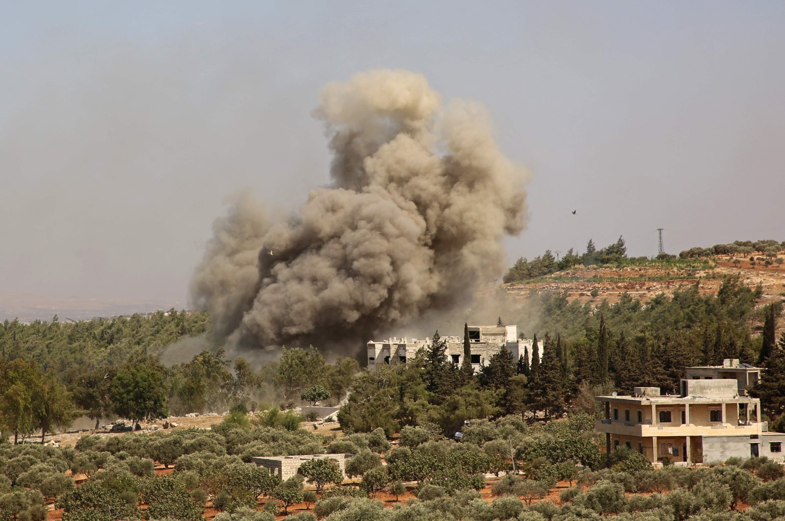 Smoke billows following a reported Russian airstrike on the western outskirts of the mostly opposition-held Syrian province of Idlib, northwestern Syria, on Sept. 20, 2020. (AFP)