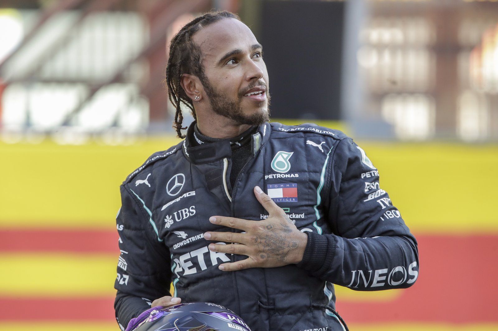 Mercedes driver Lewis Hamilton celebrates after winning the F1 Tuscany Grand Prix, at the Mugello circuit in Scarperia, Italy, Sept. 13, 2020. (AP Photo)