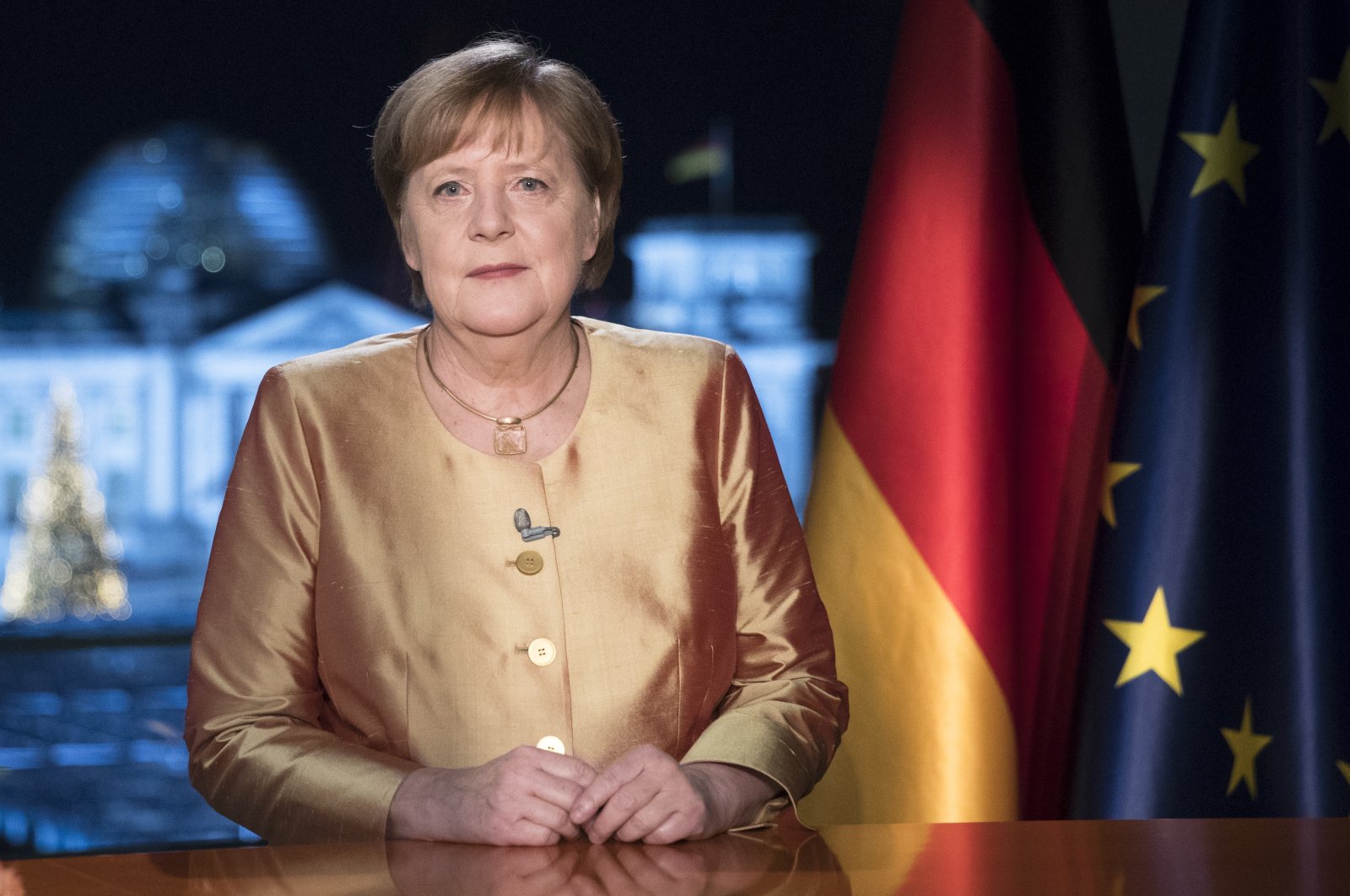 German Chancellor Angela Merkel poses for photographs after the television recording of her annual New Year's speech at the chancellery in Berlin, Germany, Wednesday, Dec. 30, 2020. (AP Photo)
