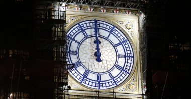 The clock-face on the Elizabeth Tower, known as Big Ben, shows midnight early on New Year's Day, Jan. 1, 2021, in London. (AFP Photo)