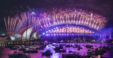 Fireworks explode over the Sydney Opera House and Harbour Bridge as New Year's celebrations begin in Sydney, Australia, Dec. 31, 2020. (AP Photo)